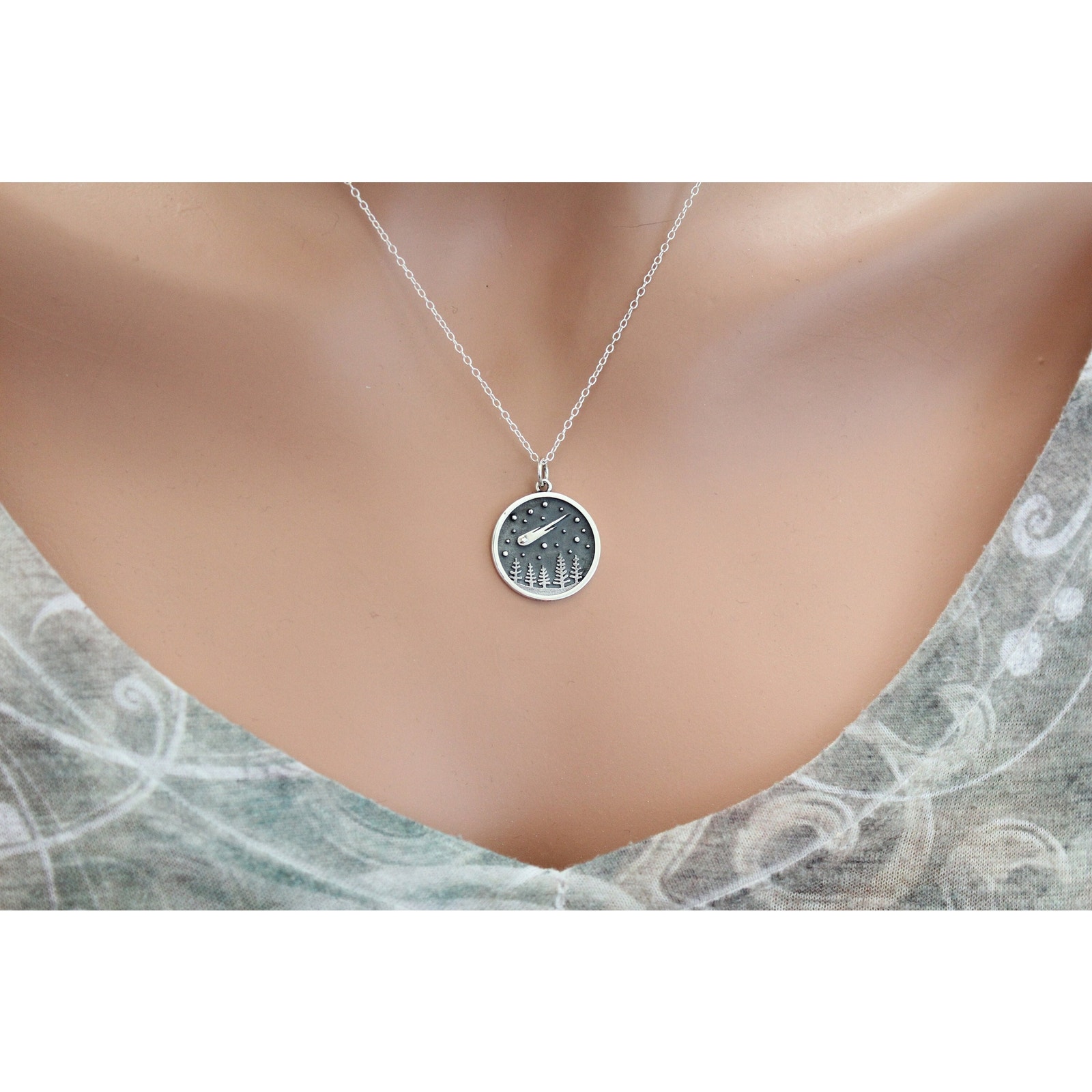 Sterling silver charm necklace photographed for a marketplace product listing